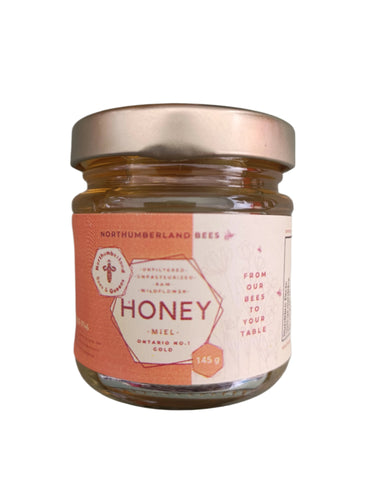 Jar of raw Ontario honey sourced from local bees.