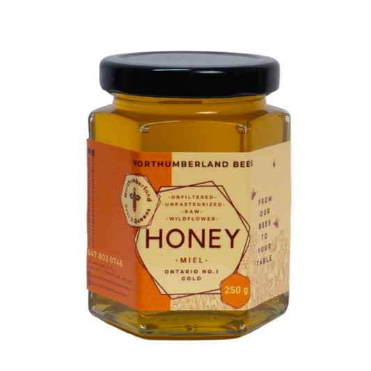 Jar of raw Ontario honey sourced from local bees.