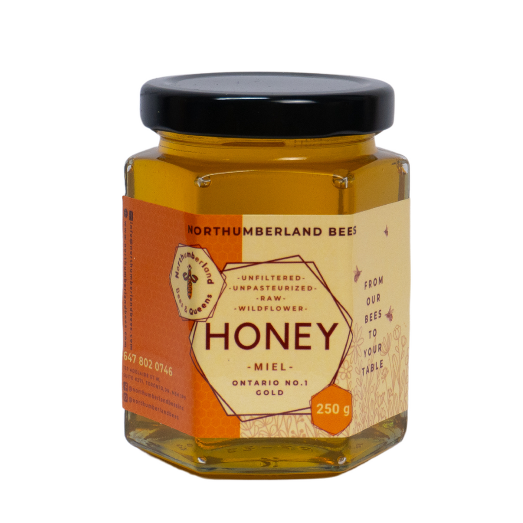 Jar of raw Ontario honey sourced from local bees.