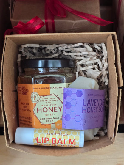 Gift set with honey, soap, and lip balm in a box